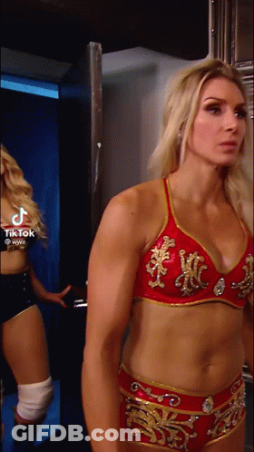 Woman In Red And Gold Bra And Shorts Standing GIF