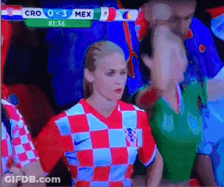 Woman In Red And White Checkered Shirt Facing Cro 0-3 Mex Screen GIF