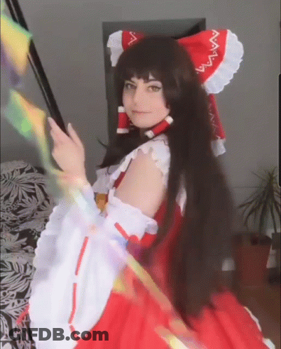 Woman In Red And White Dress And Headband GIF