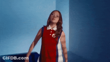 Woman In Red And White Dress Arms Outstretched GIF