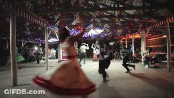 Woman In Red And White Dress Dancing In Crowd GIF