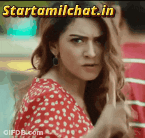 Woman In Red And White Polka Dot Dress Looking At Camera Startamilchat.in GIF