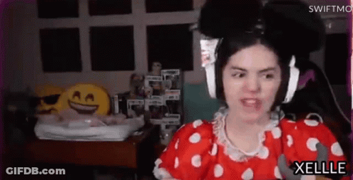 Woman In Red And White Polka Dot Dress Wearing Headphones GIF