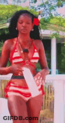 Woman In Red And White Striped Bikini On Balcony GIF