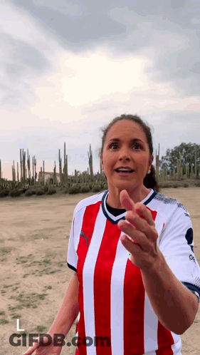 Woman In Red And White Striped Shirt In Cactus Field GIF