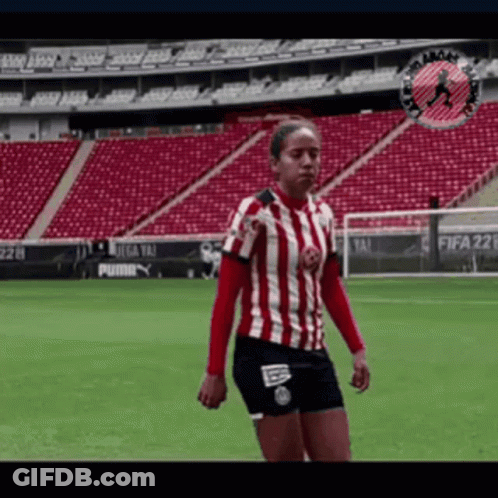 Woman In Red And White Striped Shirt On Soccer Field GIF
