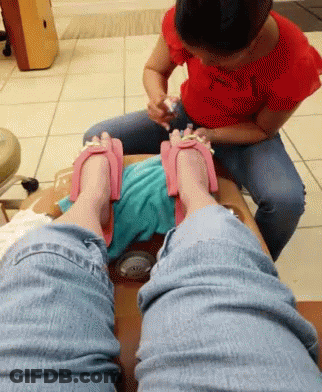 Woman In Red Applying Nail Polish GIF