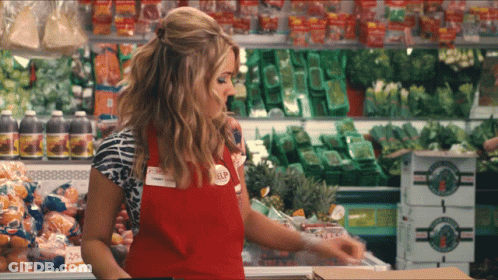 Woman In Red Apron With Elf Name Tag GIF
