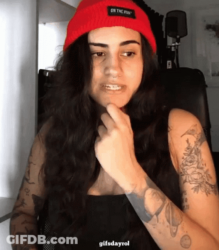 Woman In Red Beanie Saying On The Run GIF