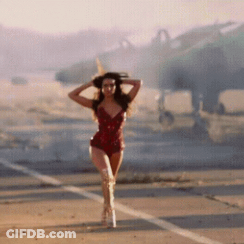 Woman In Red Bodysuit And Boots Walking GIF