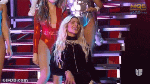 Woman In Red Bodysuit Dancing On Stage GIF