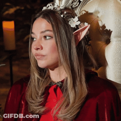 Woman In Red Cape And Elf Ears With Flower Crown GIF