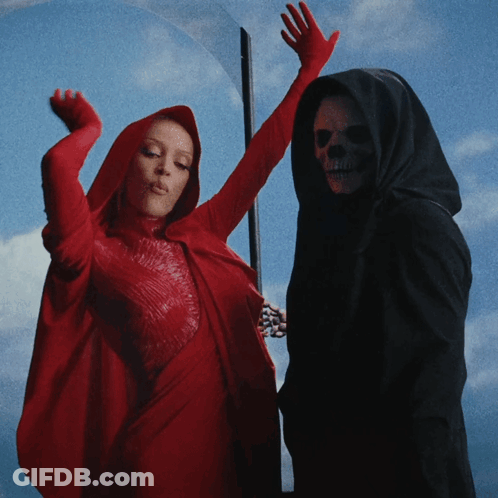 Woman In Red Cape And Grim Reaper GIF