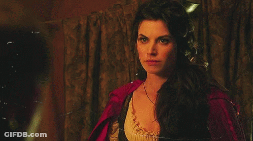 Woman In Red Cape Looking GIF