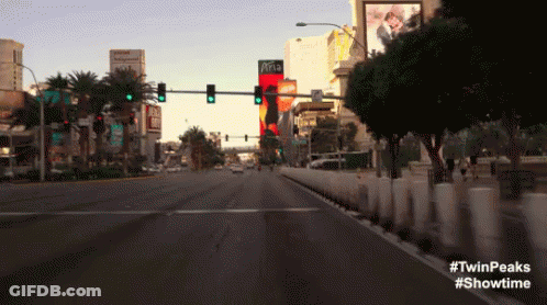 Woman In Red Cape Talking To Woman GIF