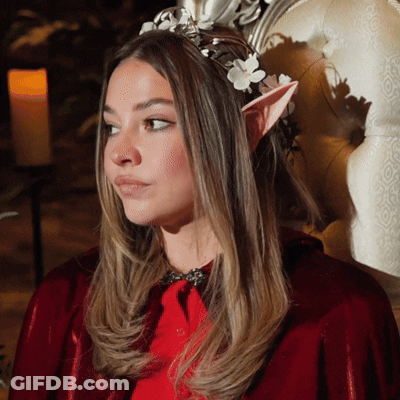 Woman In Red Cape With Elf Ears And Flower Crown GIF
