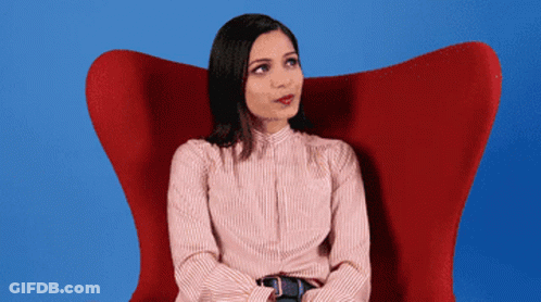 Woman In Red Chair Looking Up GIF