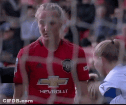 Woman In Red Chevrolet Jersey Talking To Woman In White GIF