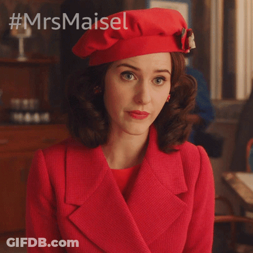 Woman In Red Coat And Beret Asking What's Going On GIF