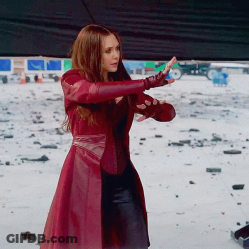 Woman In Red Coat And Gloves In Snow GIF
