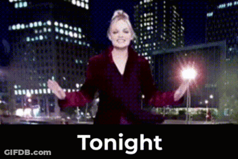 Woman In Red Coat Standing Before Tonight Sign GIF