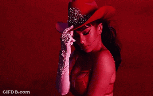 Woman In Red Cowboy Hat And White Gloves GIF