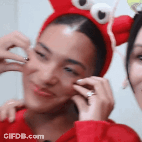 Woman In Red Crab Headband With Ring GIF