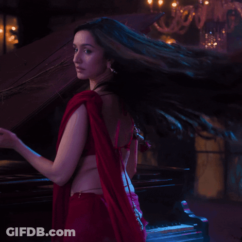 Woman In Red Crop Top And Red Saree GIF