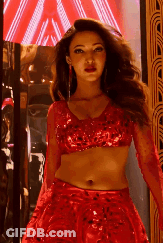 Woman In Red Crop Top And Skirt GIF