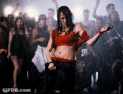 Woman In Red Dancing In Front Of Crowd With Man In 27 Shirt GIF