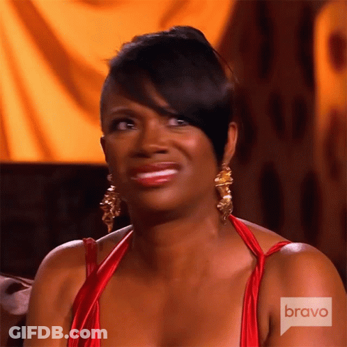 Woman In Red Dress And Gold Earrings On Bravo GIF
