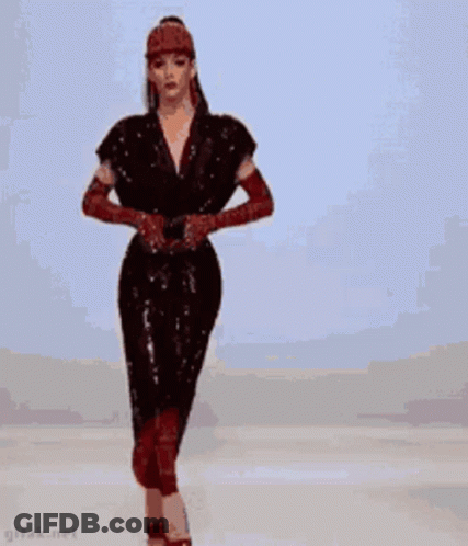 Woman In Red Dress And Heels On Runway GIF