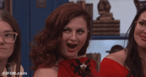 Woman In Red Dress And Red Gloves With Mouth Open GIF
