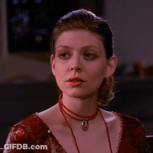 Woman In Red Dress And Red Necklace GIF