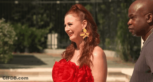 Woman In Red Dress And Yellow Earrings With Man GIF