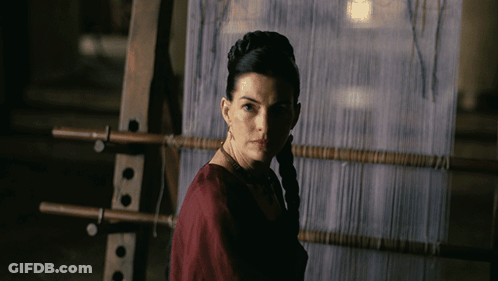 Woman In Red Dress At Loom In Dark GIF