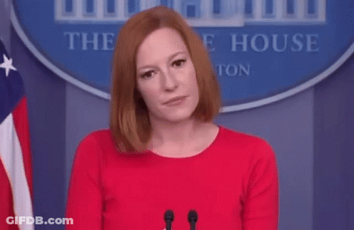 Woman In Red Dress At Microphone In Front Of White House Sign GIF
