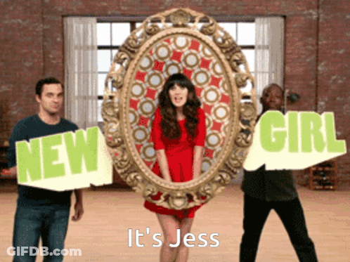 Woman In Red Dress Between Two Men Holding Signs New Girl And It's Jess GIF