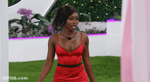 Woman In Red Dress By Pink Curtain GIF