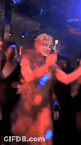 Woman In Red Dress Dancing In Club GIF