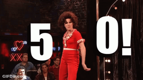 Woman In Red Dress Dancing In Front Of 5 0 Sign GIF