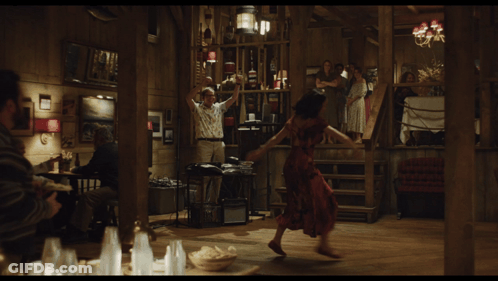 Woman In Red Dress Dancing In Wooden Room GIF