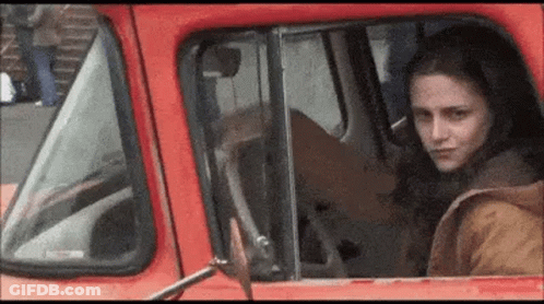 Woman In Red Dress Dancing On Highway GIF