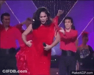 Woman In Red Dress Dancing On Stage GIF