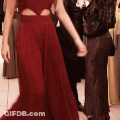 Woman In Red Dress Dancing With Man In Black GIF