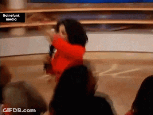 Woman In Red Dress Dancing With Microphone GIF
