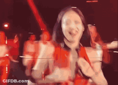 Woman In Red Dress Dancing With Microphone GIF