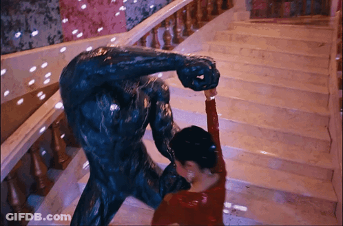 Woman In Red Dress Dancing With Statue GIF