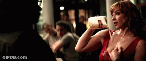Woman In Red Dress Drinking Bohemia Bottle GIF