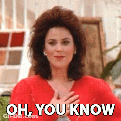 Woman In Red Dress Hands To Chest Saying Oh You Know GIF